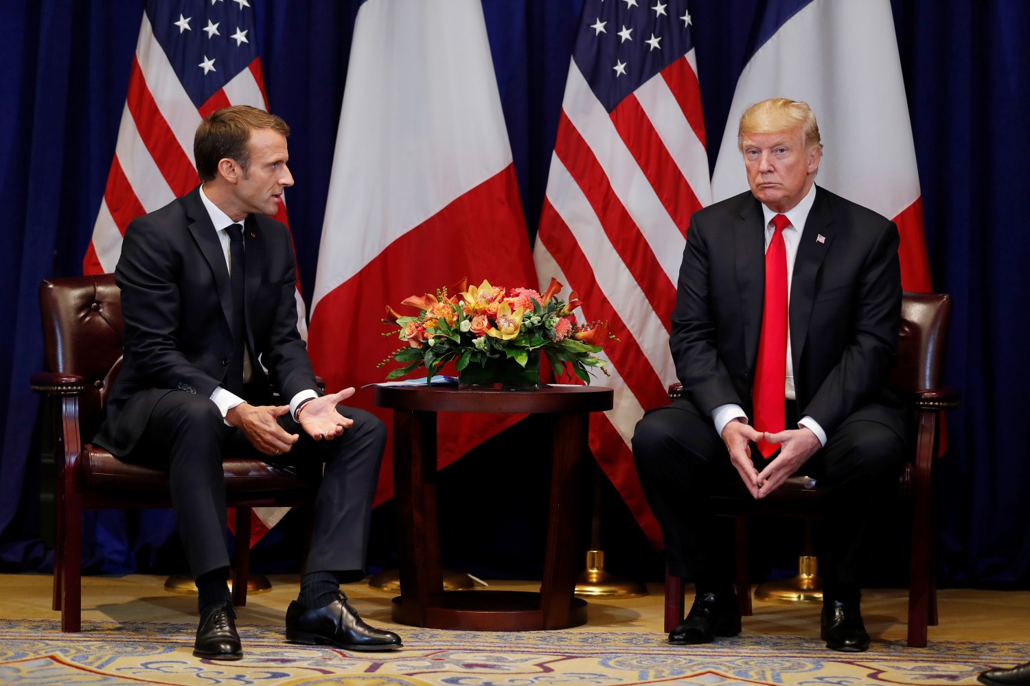 France's President Emmanuel Macron speaks to U.S. President Donald Trump as they hold a bilateral meeting on the sidelines of the 73rd United Nations General Assembly in New York, U.S., September 24, 2018. REUTERS/Carlos Barria - RC13D2AE5120