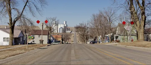 The road leading into town of Dedham, Iowa.