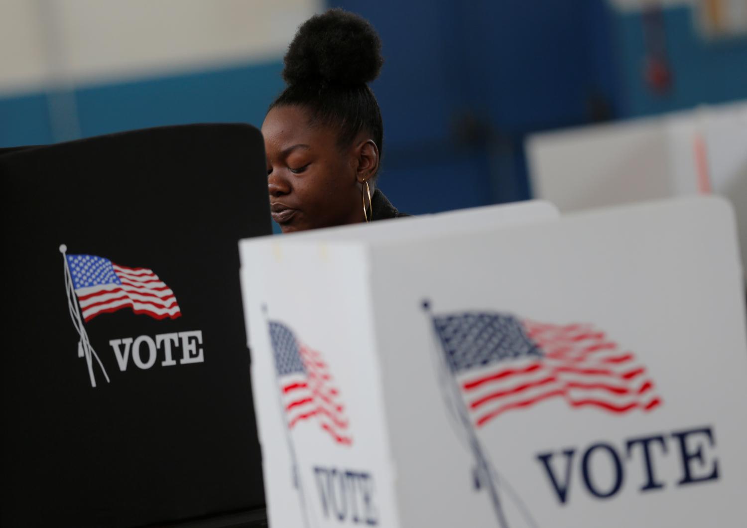 A voter casts her ballot on election day for the U.S. presidential election in Smithfield, North Carolina November 8, 2016. Picture taken November 8, 2016. REUTERS/Chris Keane - RC1828312AE0