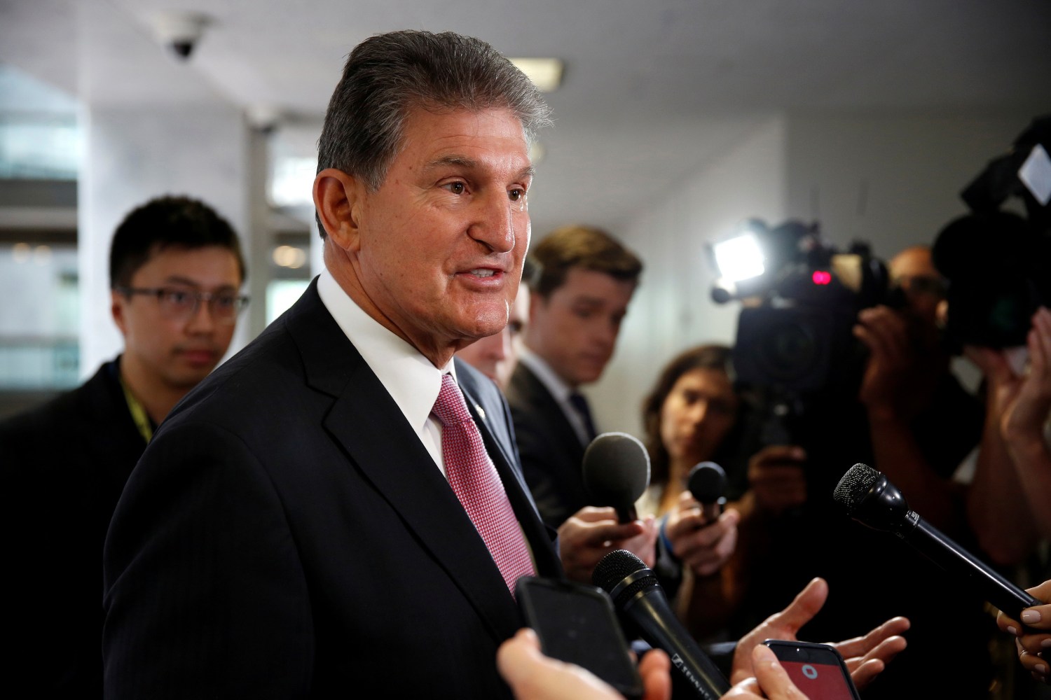 Senator Joe Manchin (D-WV) speaks to the media as he arrives for a Senate Intelligence Committee hearing evaluating the Intelligence Community Assessment on "Russian Activities and Intentions in Recent US Elections" on Capitol Hill in Washington, U.S., May 16, 2018.      REUTERS/Joshua Roberts - RC1FB49C5220