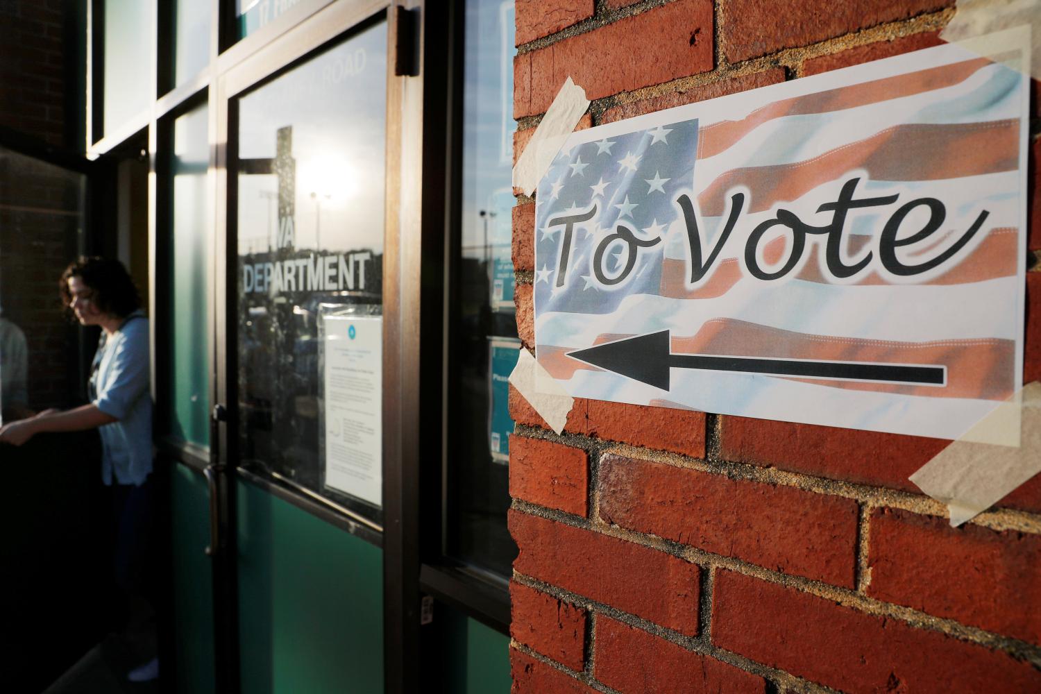 A voter leaves a polling site after casting a ballot in the Massachusetts Primary Election in Somerville.