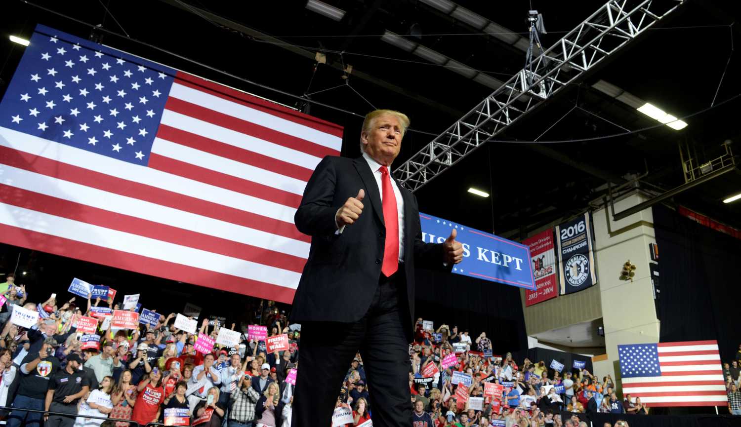 President Donald Trump gives a thumbs up to supporters as he arrives at WesBanco Arena during a Make America Great Again rally in Wheeling.