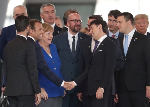 Germany's Chancellor Angela Merkel, France's President Emmanuel Macron, Belgium's Prime Minister Charles Michel and Italian Prime Minister Giuseppe Conte gather at NATO headquarters in Brussels, Belgium July 11, 2018. Tatyana Zenkovich/Pool via REUTERS - RC16DD62C000