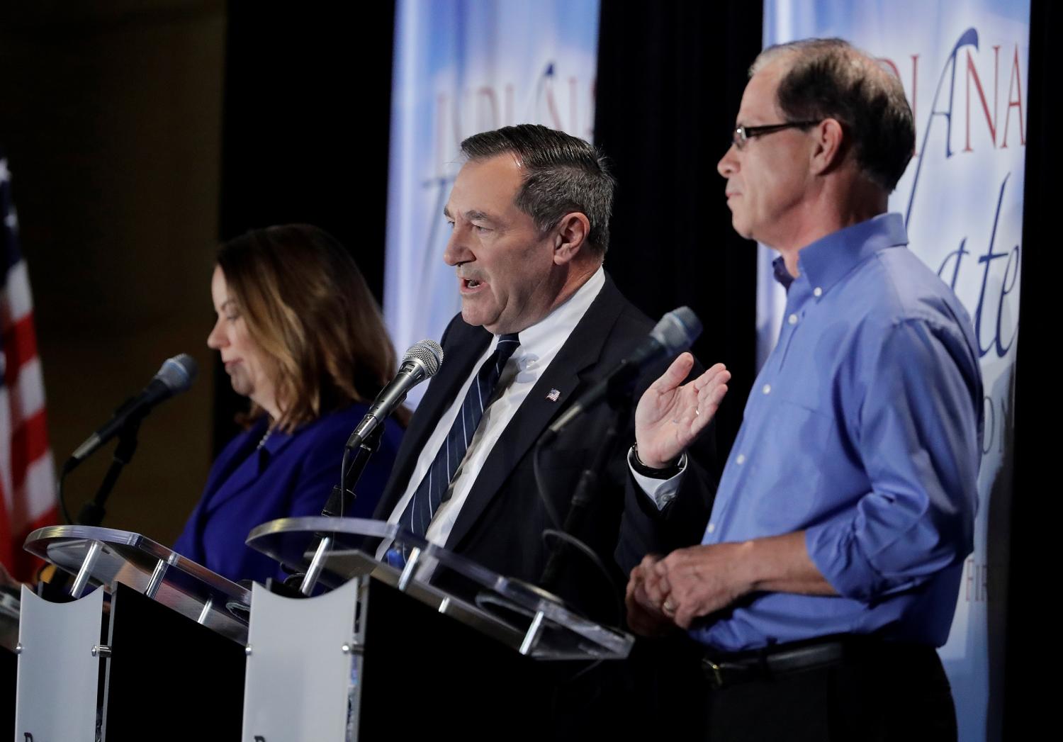 Democratic U.S. Sen. Joe Donnelly (C), speaks during a U.S. Senate Debate against Republican former state Rep. Mike Braun (R), and Libertarian Lucy Brenton (L), in Westville, Indiana, U.S., October 8, 2018.     Darron Cummings/Pool via REUTERS - RC1911A35280