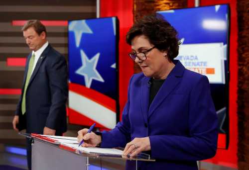 U.S. Sen. Dean Heller (L) and U.S. Rep. Jacky Rosen participate in a U.S. Senate debate in Las Vegas, Nevada, U.S., October 19, 2018. Picture taken on October 19, 2018.   John Locher/Pool via REUTERS - RC1143634700