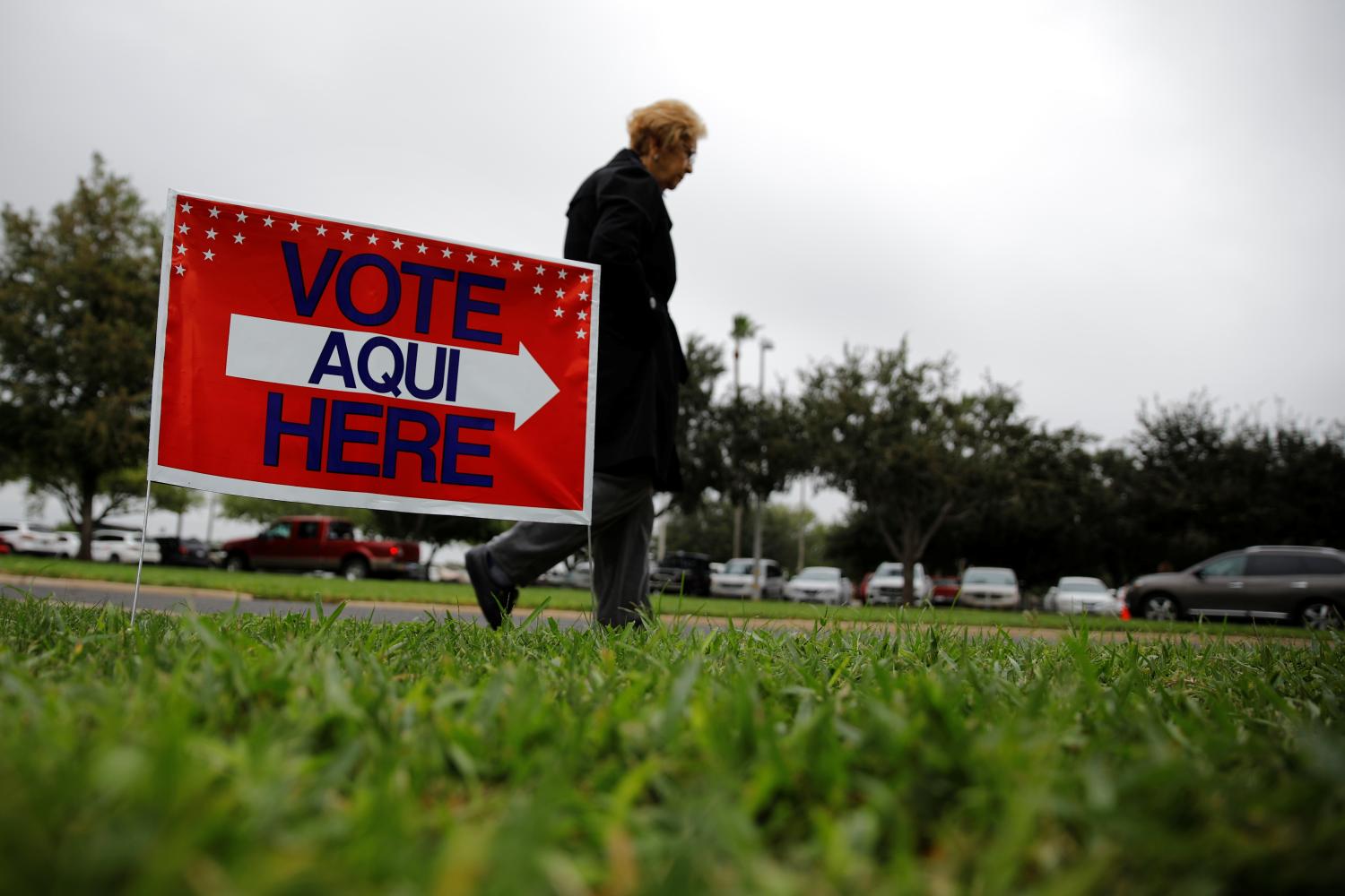A woman arrives at a polling station in Lark Community Center as the early voting for midterm elections started in Texas, in McAllen, Texas, U.S., October 22, 2018. REUTERS/Carlos Barria - RC16F40C5550