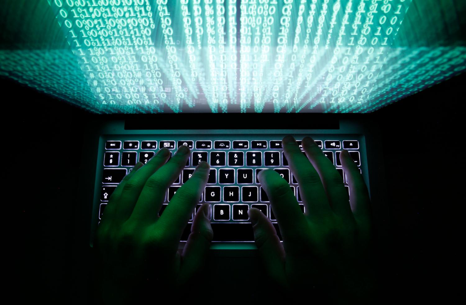 A man types on a computer keyboard in Warsaw in this February 28, 2013 illustration file picture. One of the largest ever cyber attacks is slowing global internet services after an organisation blocking "spam" content became a target, with some experts saying the disruption could get worse.        To match INTERNET-ATTACK/      REUTERS/Kacper Pempel/Files (POLAND - Tags: BUSINESS SCIENCE TECHNOLOGY) - GM1E93S08G701