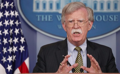 U.S. National Security Advisor John Bolton answers questions from reporters after announcing that the U.S. will withdraw from the Vienna protocol and the 1955 "Treaty of Amity" with Iran as White House Press Secretary Sarah Huckabee Sanders looks on during a news conference in the White House briefing room in Washington, U.S., October 3, 2018.      REUTERS/Jonathan Ernst - RC17A0C7F6B0