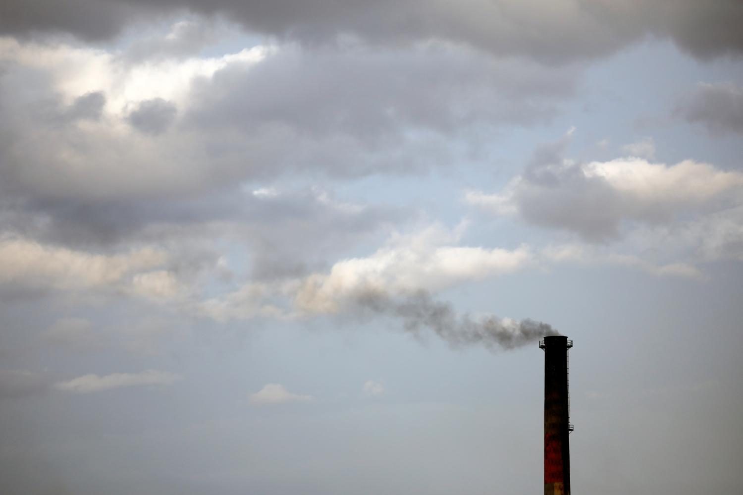 Smoke rises from a coke factory in the village of Lukavac near Tuzla, Bosnia, October 30, 2018. REUTERS/Marko Djurica - RC1B6001ACA0