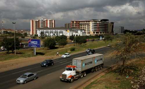 A transit truck joined the main Mombasa road from the Southern bypass road under construction next to the Nairobi national park in Kenya's capital Nairobi, March 4, 2016. REUTERS/Thomas Mukoya/File Photo - S1BETDUZYLAB