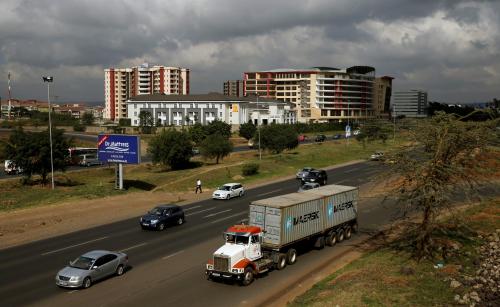 A transit truck joined the main Mombasa road from the Southern bypass road under construction next to the Nairobi national park in Kenya's capital Nairobi, March 4, 2016. REUTERS/Thomas Mukoya/File Photo - S1BETDUZYLAB