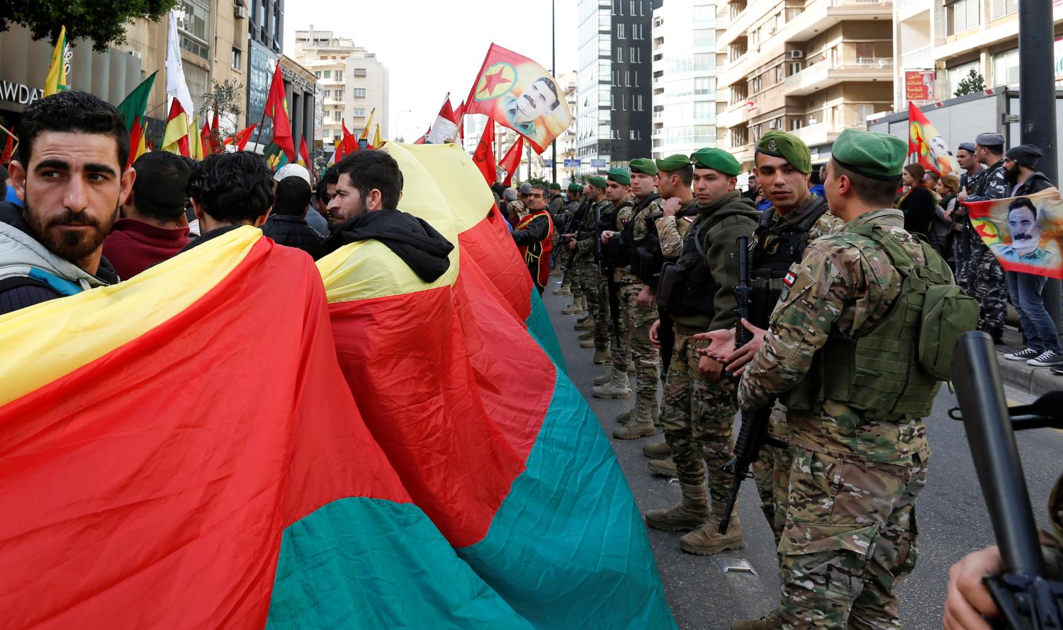 Kurdish protesters hold flags during a protest in front of the Russian embassy in Beirut, Lebanon January 22, 2018. REUTERS/Jamal Saidi - RC116BE54E90