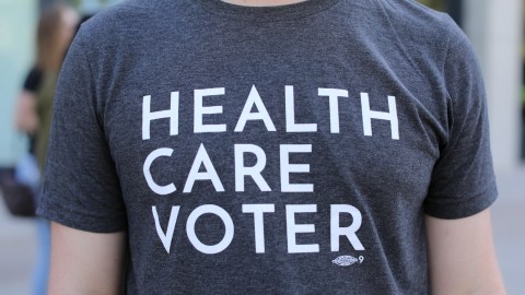 A protester wears a t-shirt as SoCal Health Care Coalition protests at UC San Diego in La Jolla, California, U.S., October 12, 2017.       REUTERS/Mike Blake - RC18361BA750