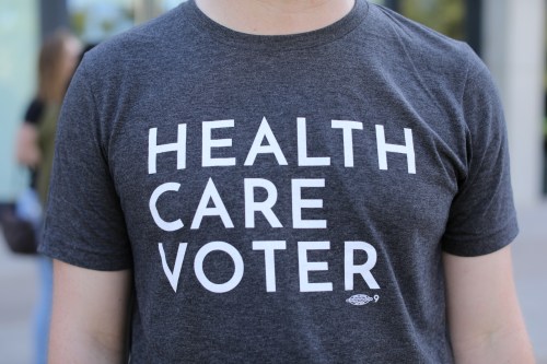 A protester wears a t-shirt as SoCal Health Care Coalition protests at UC San Diego in La Jolla, California, U.S., October 12, 2017.       REUTERS/Mike Blake - RC18361BA750