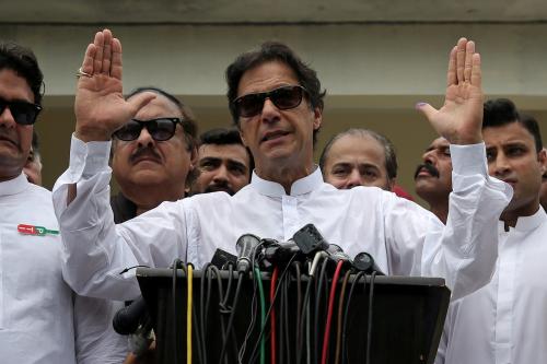 Cricket star-turned-politician Imran Khan, chairman of Pakistan Tehreek-e-Insaf (PTI), speaks to members of media after casting his vote at a polling station during the general election in Islamabad, Pakistan, July 25, 2018. REUTERS/Athit Perawongmetha      TPX IMAGES OF THE DAY - RC163C748B00