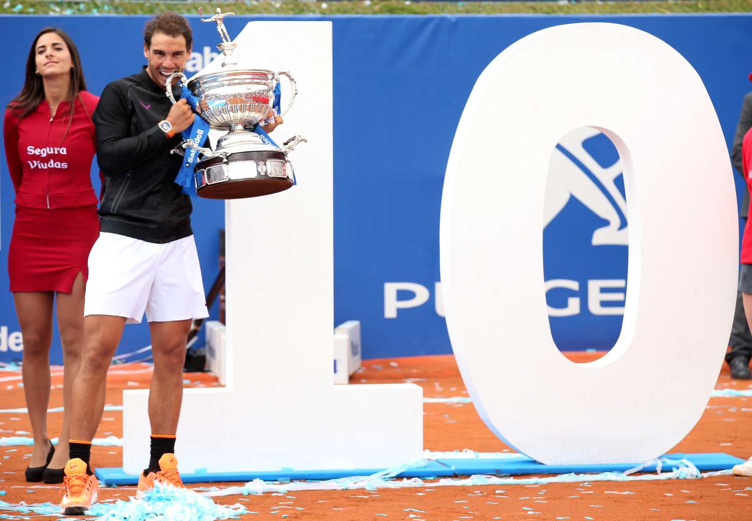 Tennis - Barcelona Open Final - Rafael Nadal of Spain v Dominic Thiem of Austria - Real Club de Tenis Barcelona, Spain - 30/04/17 - Rafael Nadal poses with a number 10 after winning the Barcelona Open title for the 10th time. REUTERS/Albert Gea - RC1494E7ACC0