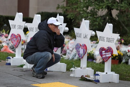 A man reacts at a makeshift memorial outside the Tree of Life synagogue following Saturday's shooting at the synagogue in Pittsburgh, Pennsylvania, U.S., October 29, 2018.   REUTERS/Cathal McNaughton - RC1530DEE0B0