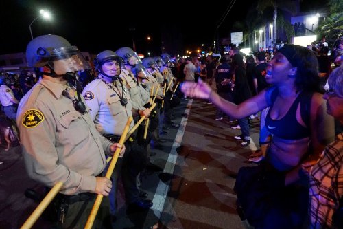 Protesters gather along Broadway Avenue to protest the fatal shooting of an unarmed black man on Tuesday by officers in El Cajon, California, U.S. September 28, 2016.  REUTERS/Sandy Huffaker/File Photo - TM3EC9T065Y01