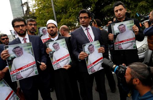Human rights activists and friends of Saudi journalist Jamal Khashoggi hold his pictures during a protest outside the Saudi Consulate in Istanbul, Turkey October 8, 2018. REUTERS/Murad Sezer - RC11BADE6ED0