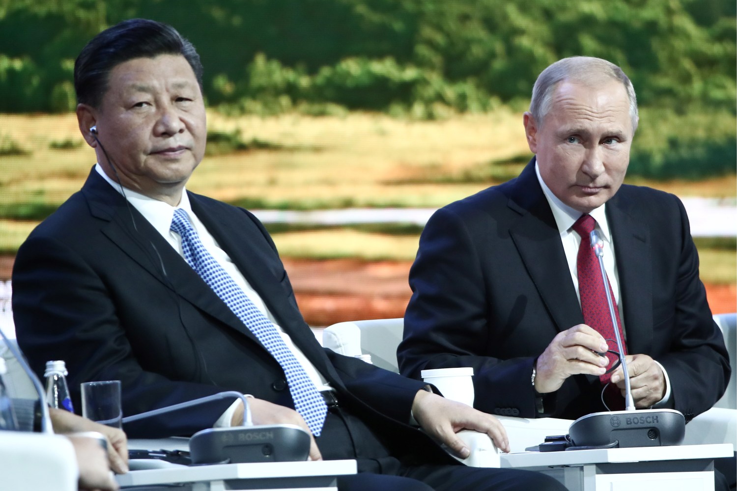Russian President Vladimir Putin (R) and Chinese President Xi Jinping attend a session of the Eastern Economic Forum in Vladivostok, Russia September 12, 2018. Valery Sharifulin/TASS Host Photo Agency/Pool via REUTERS - RC16A745C5C0