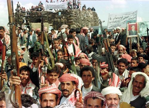 Armed tribal Yemenis hold their weapons above their heads in a show of support for independent condidate Abdullah Al-Buchri in Koneib west of Sanaa April 26. Yemenis, still recovering from a bitter 1994 civil war, are due to cast votes on Sunday in parliamentary elections.YEMEN ELECTIONS - RP1DRICTBWAE