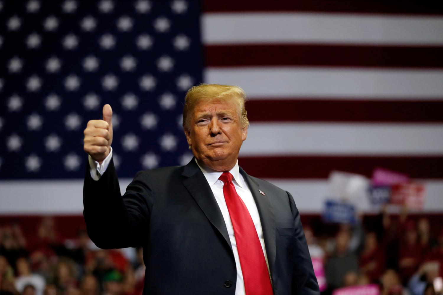 FILE PHOTO: U.S. President Donald Trump gestures to supporters during a campaign rally at the Allen County War Memorial Coliseum in Fort Wayne, Indiana, U.S., November 5, 2018.  REUTERS/Carlos Barria/File Photo - RC13BA61D600