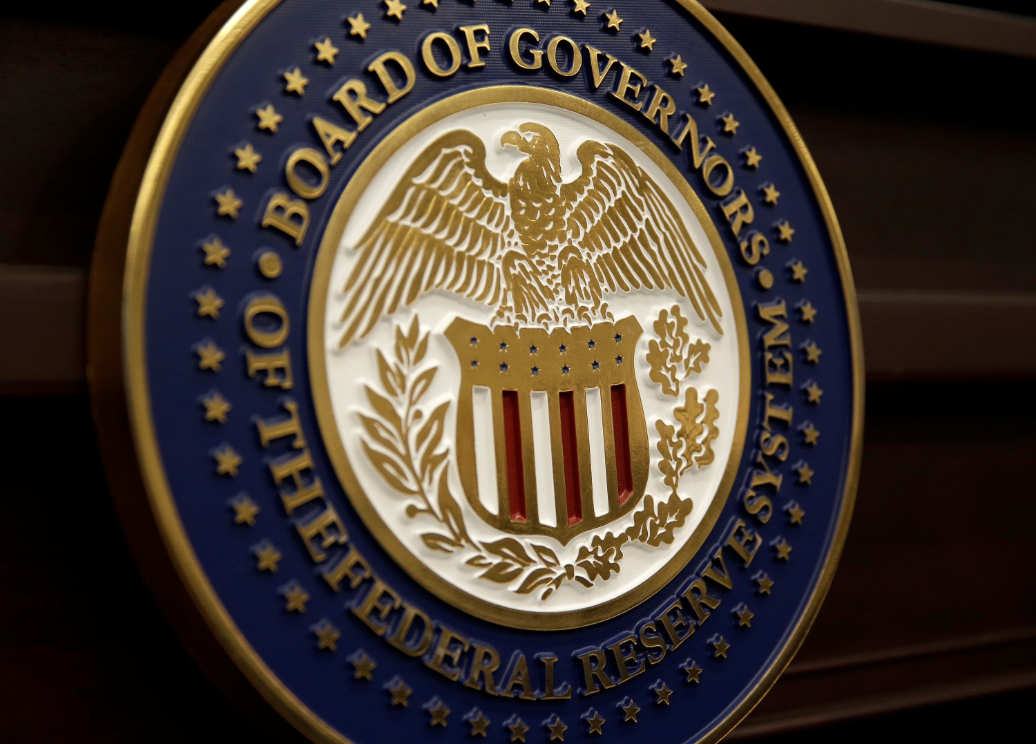 The seal for the Board of Governors of the Federal Reserve System is displayed in Washington, U.S., June 14, 2017.   REUTERS/Joshua Roberts - RC18FB5E1BA0