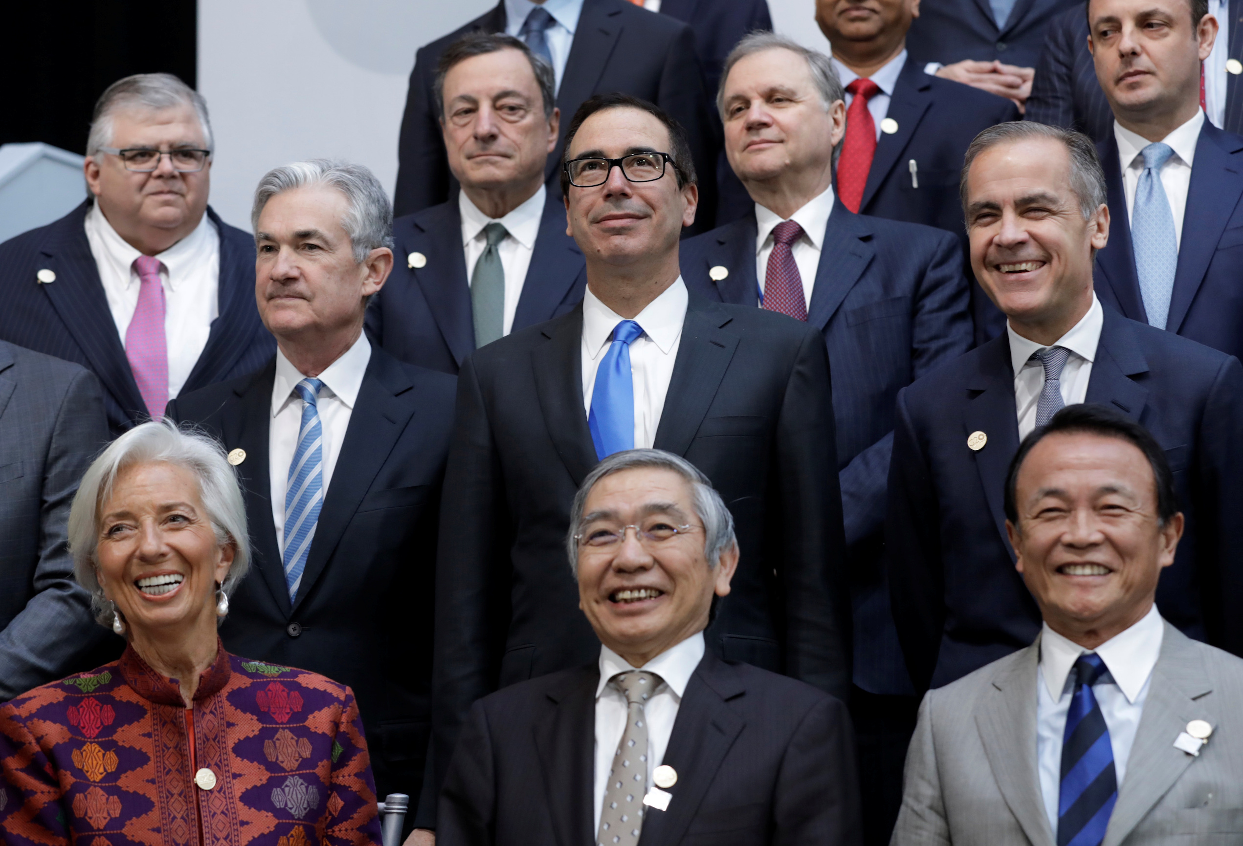 U.S. Treasury Secretary Steve Mnuchin (C) poses for G-20 finance ministers and central banks governors family photo during the IMF/World Bank spring meeting in Washington, U.S., April 20, 2018. REUTERS/Yuri Gripas - RC14DAD6E380