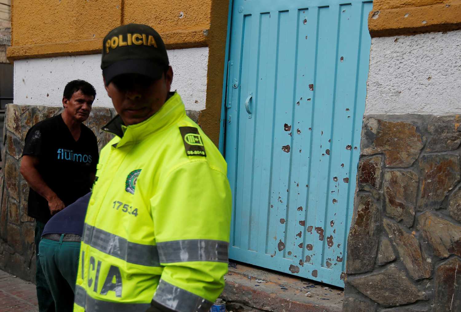 A police officer works the scene where an explosion occurred near Bogota's bullring, Colombia, February 19, 2017. REUTERS/Jaime Saldarriaga - RC16A8416680