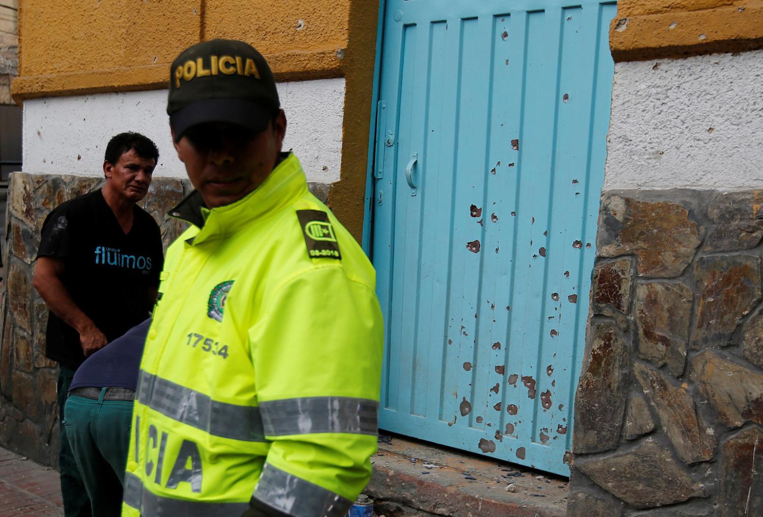 A police officer works the scene where an explosion occurred near Bogota's bullring, Colombia, February 19, 2017. REUTERS/Jaime Saldarriaga - RC16A8416680