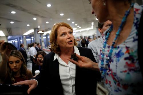 Sen. Heidi Heitkamp (D-ND) speaks with reporters ahead of the weekly policy luncheons on Capitol Hill in Washington, U.S., July 24, 2018.  REUTERS/Aaron P. Bernstein - RC1E5FB6CD50