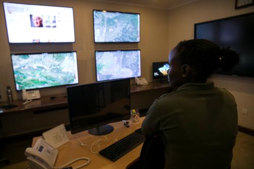 Alina Peter, AP-Ops Room Coordinator at the Singita Grumeti Fund watches screens displaying information coming from EarthRanger, a real-time conservation data visualisation and analysis software in the operations room at the Singita Grumeti Game Reserve, Tanzania, October 7, 2018. Picture taken October 7, 2018. REUTERS/Baz Ratner - RC1E4F1F3070