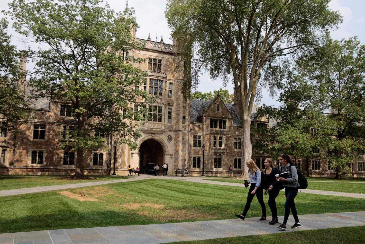 Students walk in the courtyard of the Law school at the University of Michigan in Ann Arbor, Michigan, U.S., September 20, 2018.  Picture taken on September 20, 2018.  REUTERS/Rebecca Cook - RC12527F9EE0