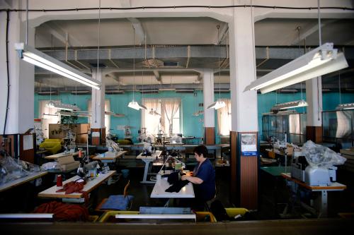 An employee of clothing retailer Arena Modna Kuca sews in the company's factory in the Adriatic town of Pula July 1, 2014. Picture taken July 1, 2014. To match Special Report BALKANS-SALARIES/ REUTERS/Antonio Bronic (CROATIA - Tags: BUSINESS EMPLOYMENT SOCIETY TEXTILE) - GM1EA7A0T0S01