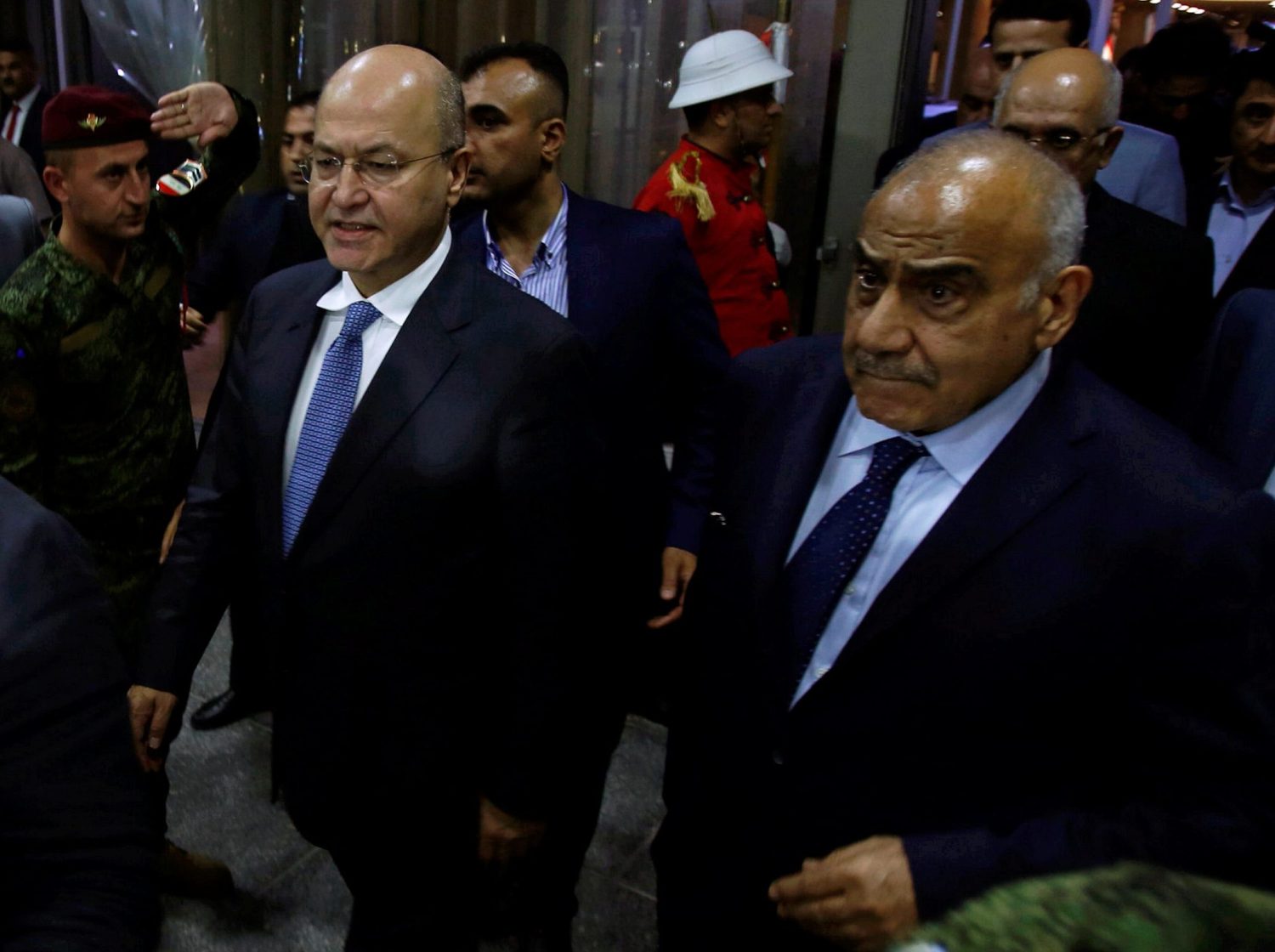 Barham Salih, Iraq's newly elected president, walks with Iraq's new Prime Minister Adel Abdul Mahdi at the parliament headquarters, in Baghdad, Iraq October 2, 2018. REUTERS/Khalid al Mousily - RC14461FCEC0