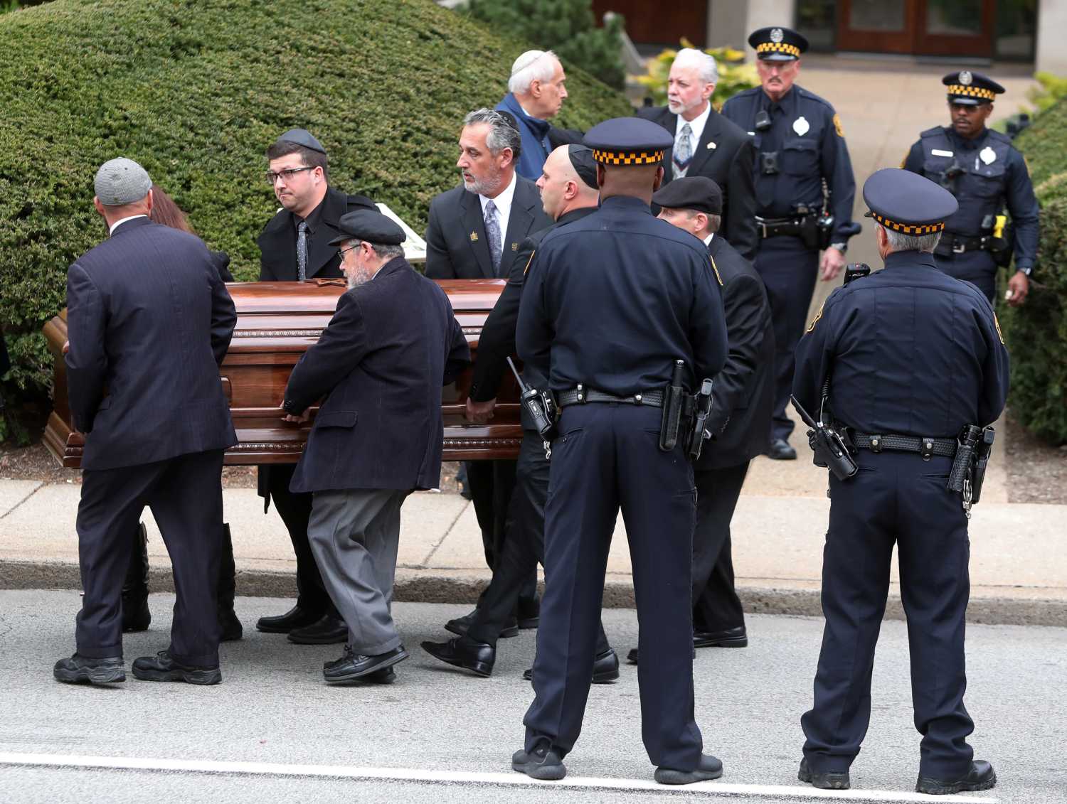 The casket of Irving Younger, 69, a victim of Saturday's synagogue shooting, is carried to a waiting hearse after his funeral at Rodef Shalom Temple in Pittsburgh, Pennsylvania, U.S., October 31, 2018. REUTERS/Cathal McNaughton - RC139D4D11A0