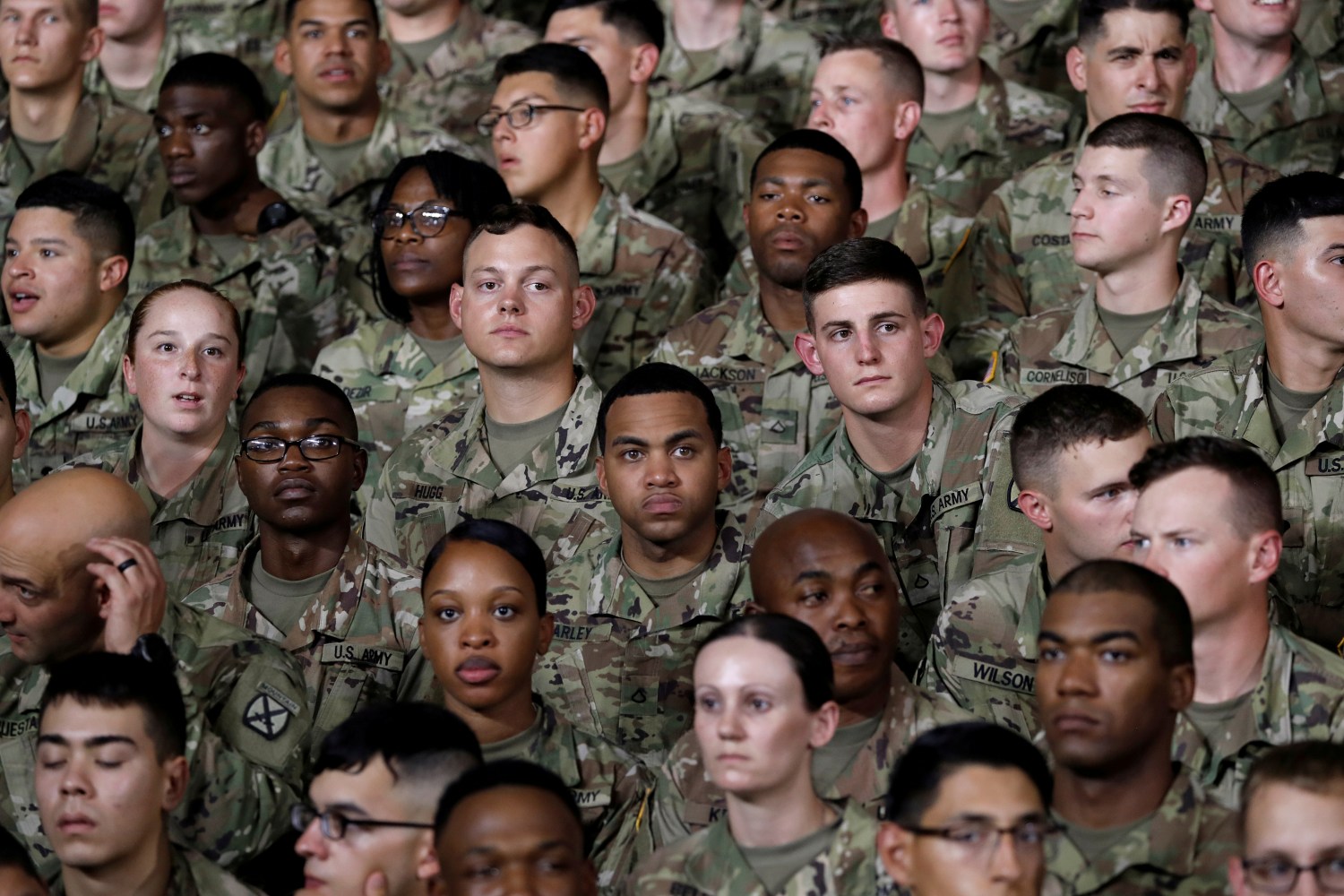 U.S. Army 10th Mountain Division soldiers listen as President Donald Trump speaks before signing the National Defense Authorization Act at Fort Drum, New York, U.S., August 13, 2018.  REUTERS/Carlos Barria      TPX IMAGES OF THE DAY - RC12B4CBE340