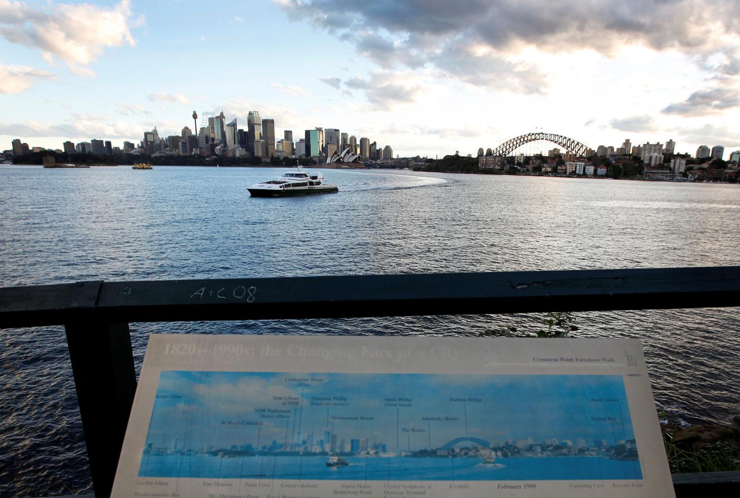 A commuter ferry passes by in front of the Sydney city skyline May 23, 2011. A team of Australia's top scientists warned on Monday of dire climate change in calling for the nation's carbon-dominated energy sector to turn green, as the government struggles to win support for a carbon price to cut pollution. The report by a government-appointed Climate Commission said many of Australia's major cities faced a serious threat from rising sea-levels, particularly Sydney. REUTERS/Tim Wimborne (AUSTRALIA - Tags: ENVIRONMENT POLITICS BUSINESS ENERGY CITYSCAPE) - GM1E75N19Y201