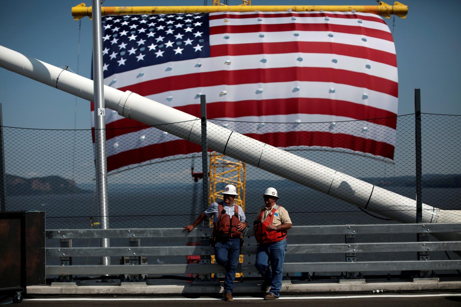 Ironworkers and brothers Randy (L) and Peter Meche, stand by during a dedication ceremony for the new Governor Mario M. Cuomo Bridge that is to replace the current Tappan Zee Bridge over the Hudson River in Tarrytown, New York, U.S., August 24, 2017. REUTERS/Mike Segar - RC1A71EE0590
