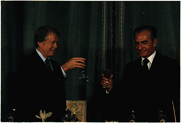 President Jimmy Carter and Shah Mohammed Reza Pahlavi raise their glasses in a toast during the president's visit to Tehran. / National Archives