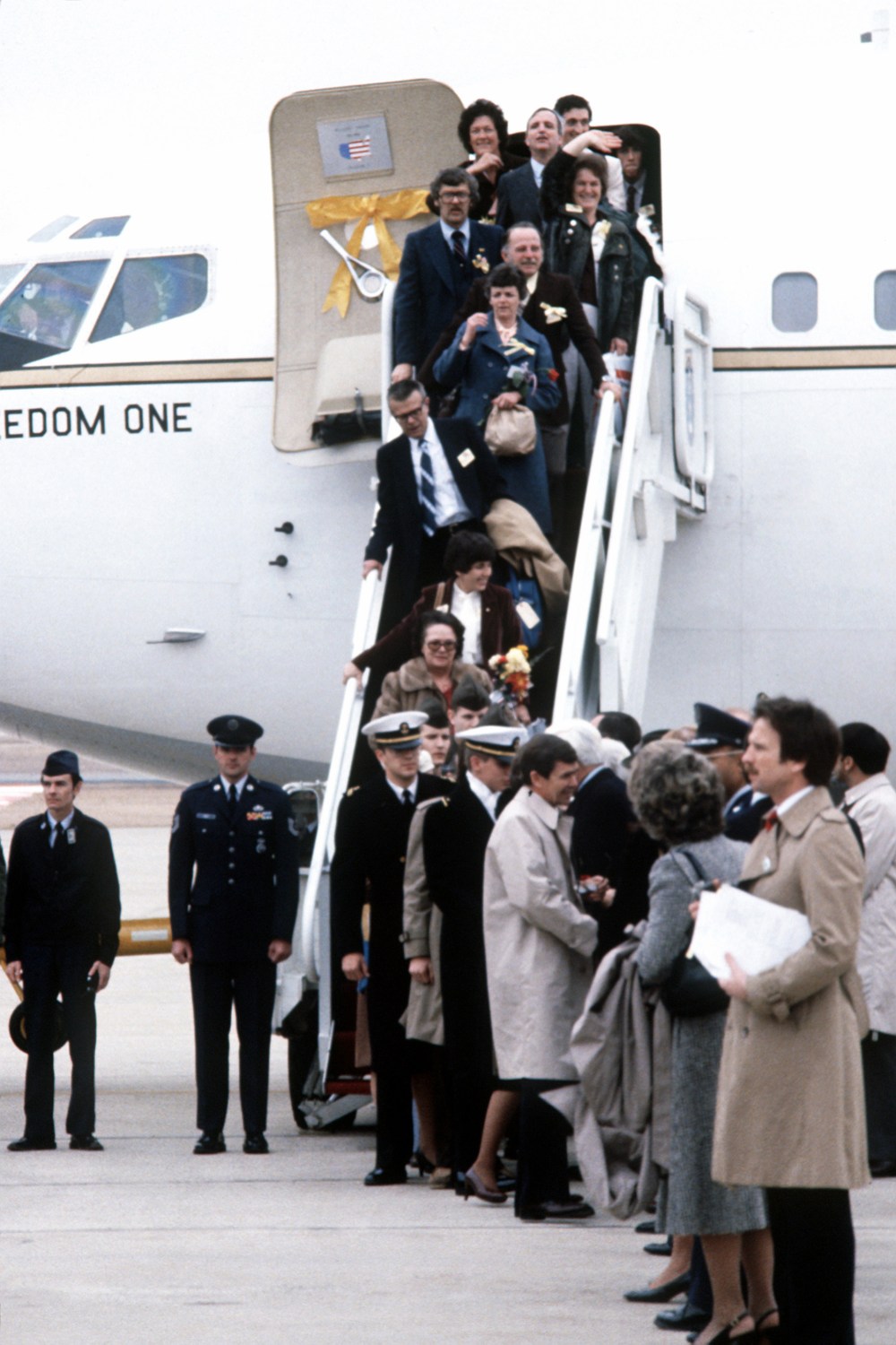 Former Iranian hostages and their families disembark their plane upon their arrival at Andrews Air Force Base. / National Archives