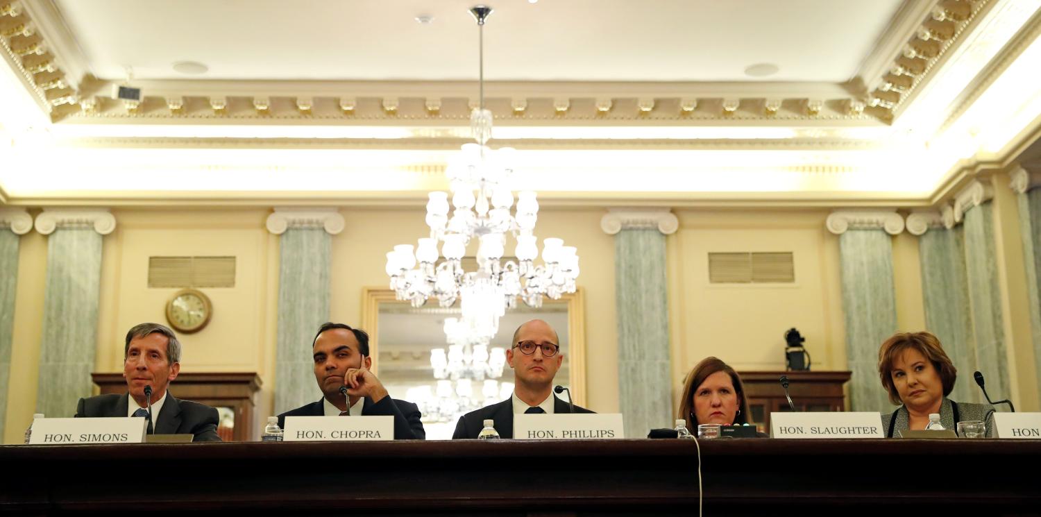 Federal Trade Chairman Joseph Simons, (L), Federal Trade Commissioners (2nd L-R), Rohit Chopra, Noah Phillips, Rebecca Slaughter and Christine Wilson testify on the "Oversight of the Federal Trade Commission" before the U.S. Senate Consumer Protection, Product Safety, Insurance and Data Security Subcommittee in the Russell Senate Office Building in Washington, U.S., November 27, 2018. REUTERS/ Leah Millis - RC1654D52A80