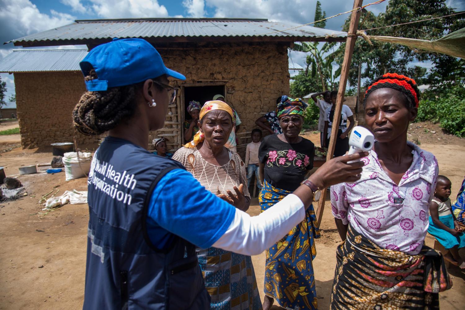 Dr.†Marie-Roseline Darnycka BÈlizaire, World Health Organisation (WHO) Epidemiology Team Lead, talks to women as part of Ebola contact tracing, in Mangina, Democratic Republic of Congo August 26, 2018. Picture taken August 26, 2018.   WHO/Junior Kannah/Handout via REUTERS ATTENTION EDITORS - THIS IMAGE HAS BEEN SUPPLIED BY A THIRD PARTY. - RC1AE1BC5700