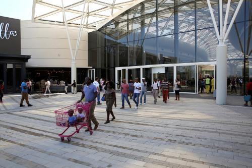 Shoppers walk during the opening of the 'Mall of Africa' in Midrand outside Johannesburg, South Africa April 28, 2016. REUTERS/Siphiwe Sibeko - D1AETAYSBVAB