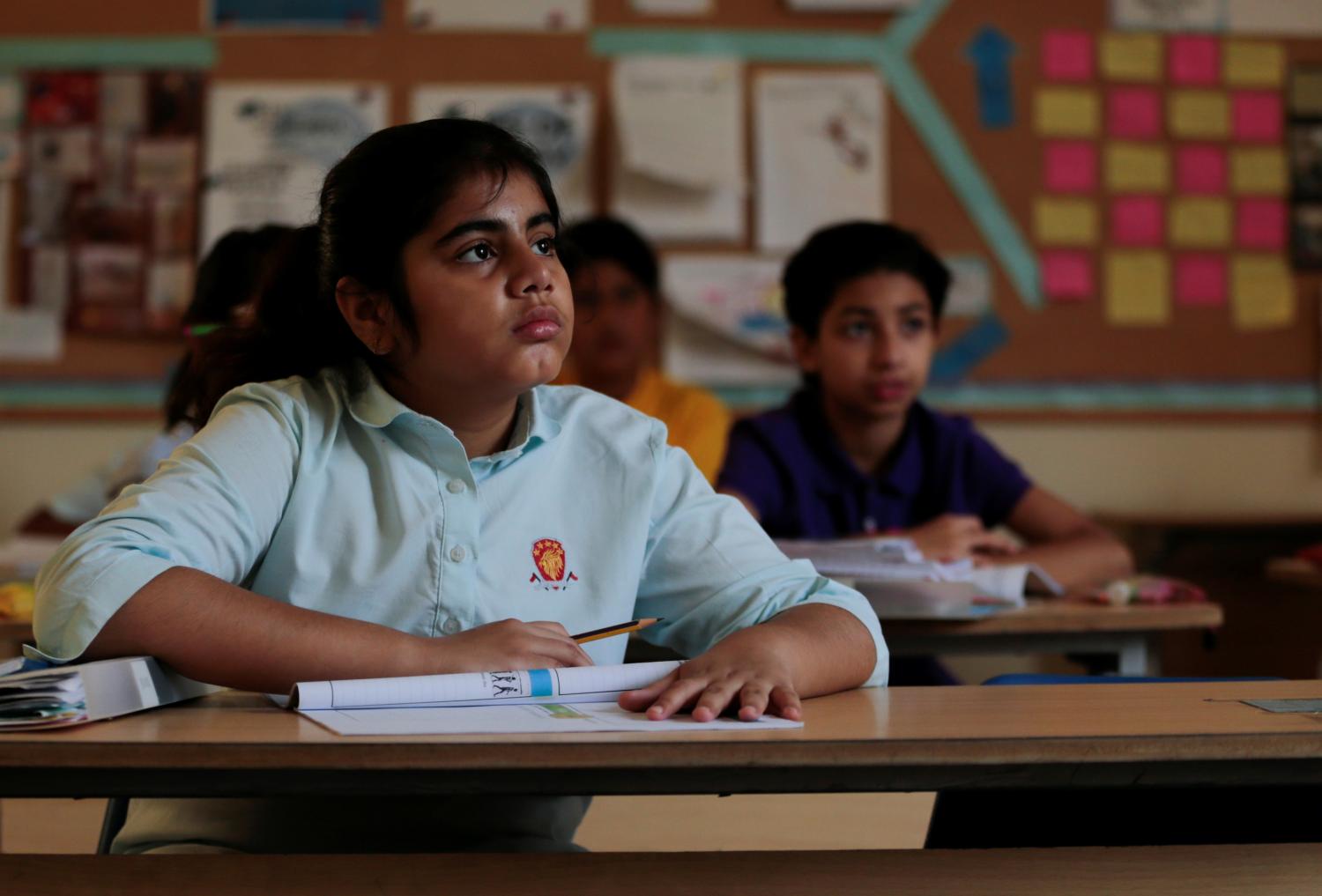 Students attend class at the Headstart private school in Islamabad, Pakistan, October 9, 2017. REUTERS/Caren Firouz  SEARCH "FIROUZ EDUCATION" FOR THIS STORY. SEARCH "WIDER IMAGE" FOR ALL STORIES. - RC19A8C65A60