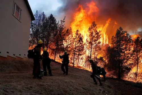 A group of U.S. Forest Service firefighters monitor a back fire while battling to save homes at the Camp Fire in Paradise, California, U.S. November 8, 2018. REUTERS/Stephen Lam     TPX IMAGES OF THE DAY - RC13174EDFB0