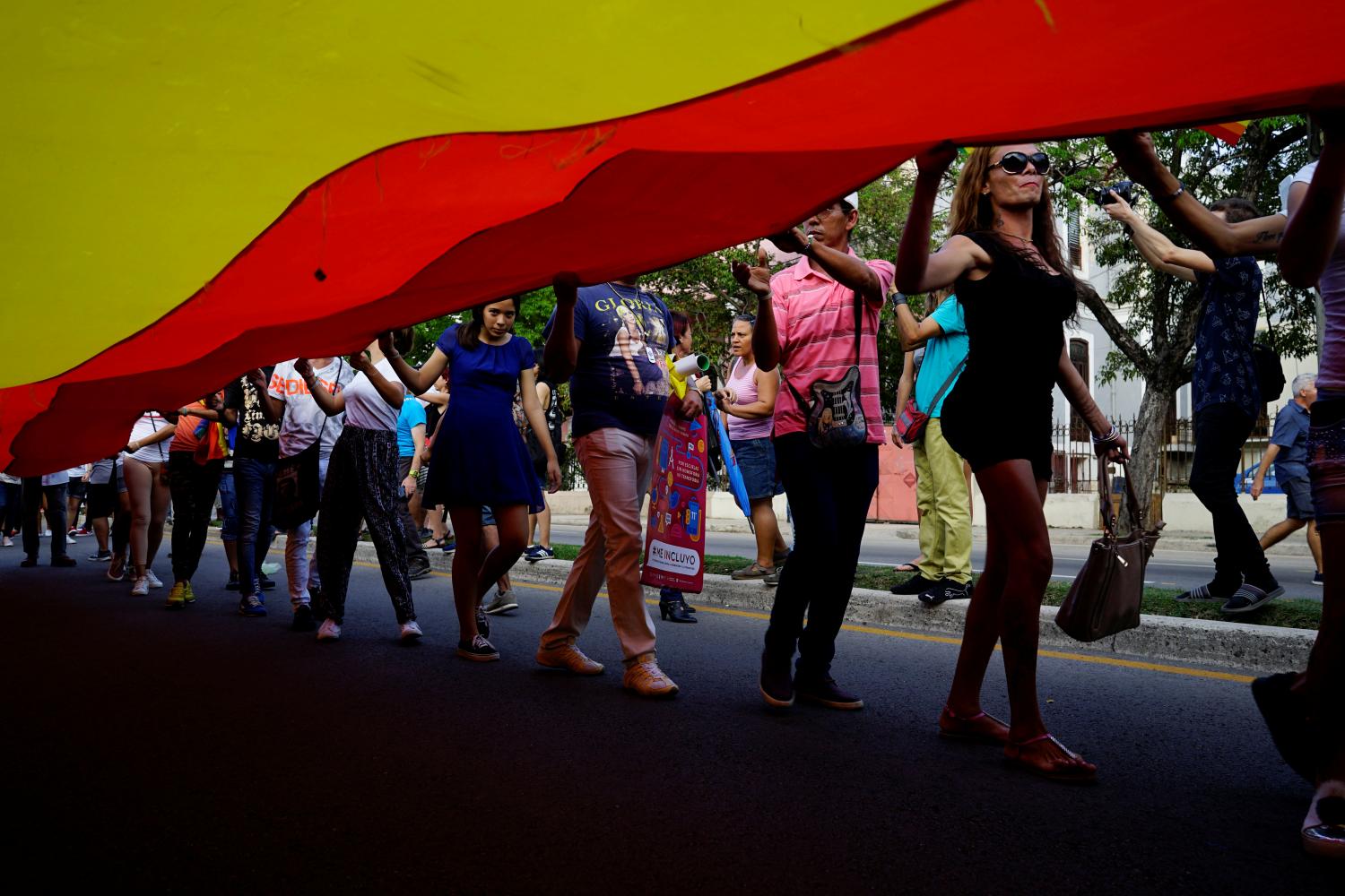 Gay rights activists carry a rainbow flag during the 11th annual March against Homophobia and Transphobia in Havana, Cuba, May 12, 2018. REUTERS/Alexandre Meneghini - RC1CEDDEEF00