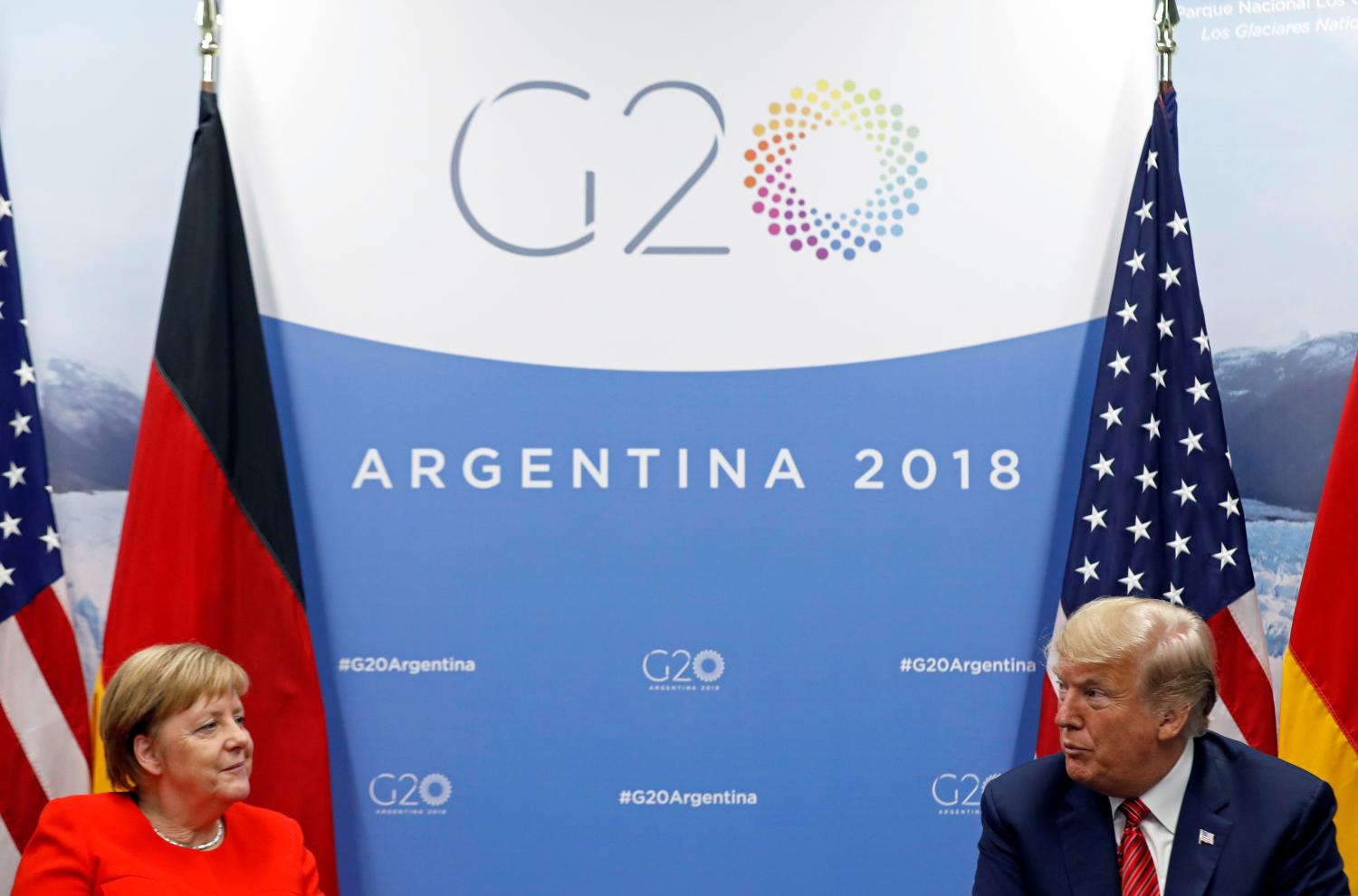 U.S. President Donald Trump and German Chancellor Angela Merkel attend a meeting during the G20 leaders summit in Buenos Aires, Argentina December 1, 2018. REUTERS/Kevin Lamarque - RC1835828BD0