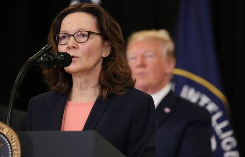 New CIA Director Gina Haspel speaks as President Donald Trump looks on after Haspel was sworn in during ceremonies at the headquarters of the Central Intelligence Agency in Langley, Virginia, U.S. May 21, 2018.  REUTERS/Kevin Lamarque - RC1BB6CAB1B0