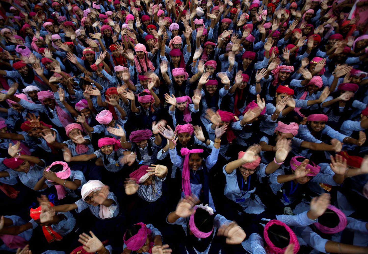School girls wearing pink turbans wave during celebrations to mark International Day of the Girl Child 2018, at a school in Chandigarh, India October 11, 2018. REUTERS/Ajay Verma     TPX IMAGES OF THE DAY - RC1336C3B510
